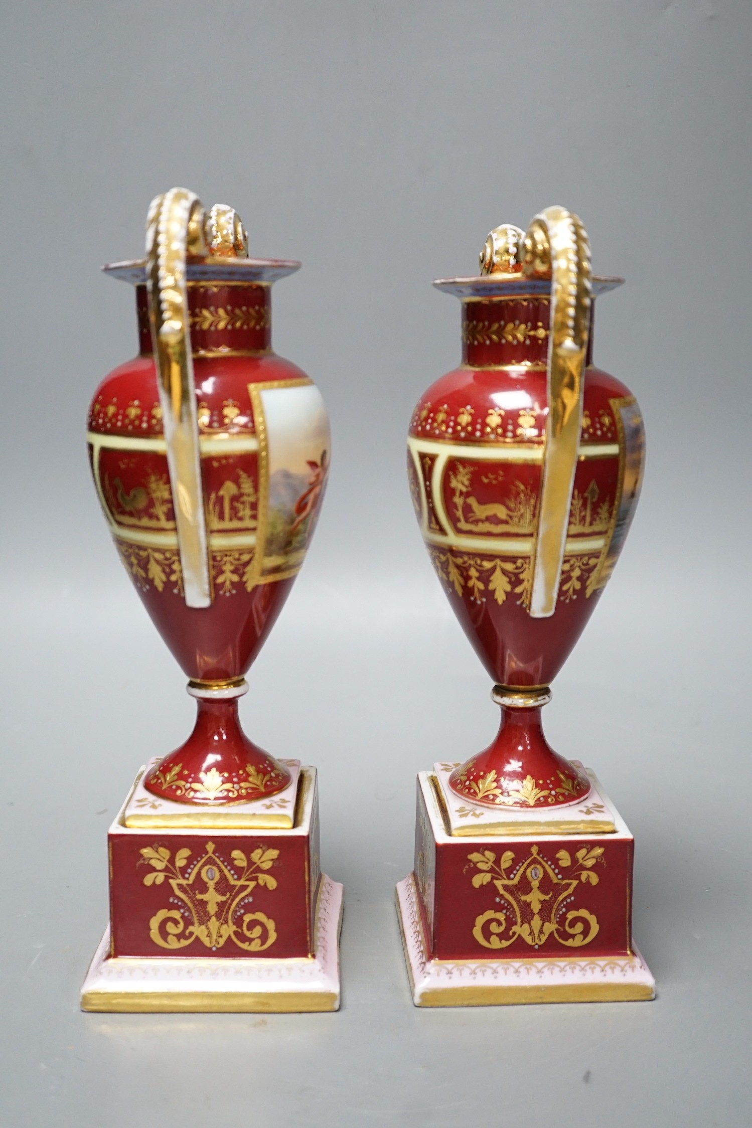 A pair of Vienna style painted porcelain vases, early 20th century 25cm